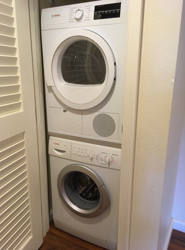 部屋に完備された洗濯・乾燥機